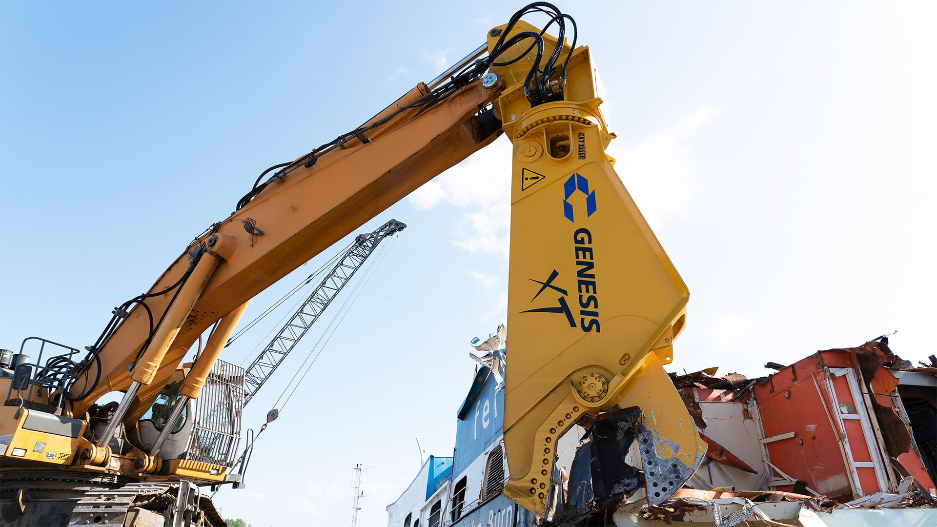 Genesis GXT 1555R Steel Shear in Ship Recycling Genesis GXT 1555R hydraulic steel shear cutting a ship structure during ship recycling